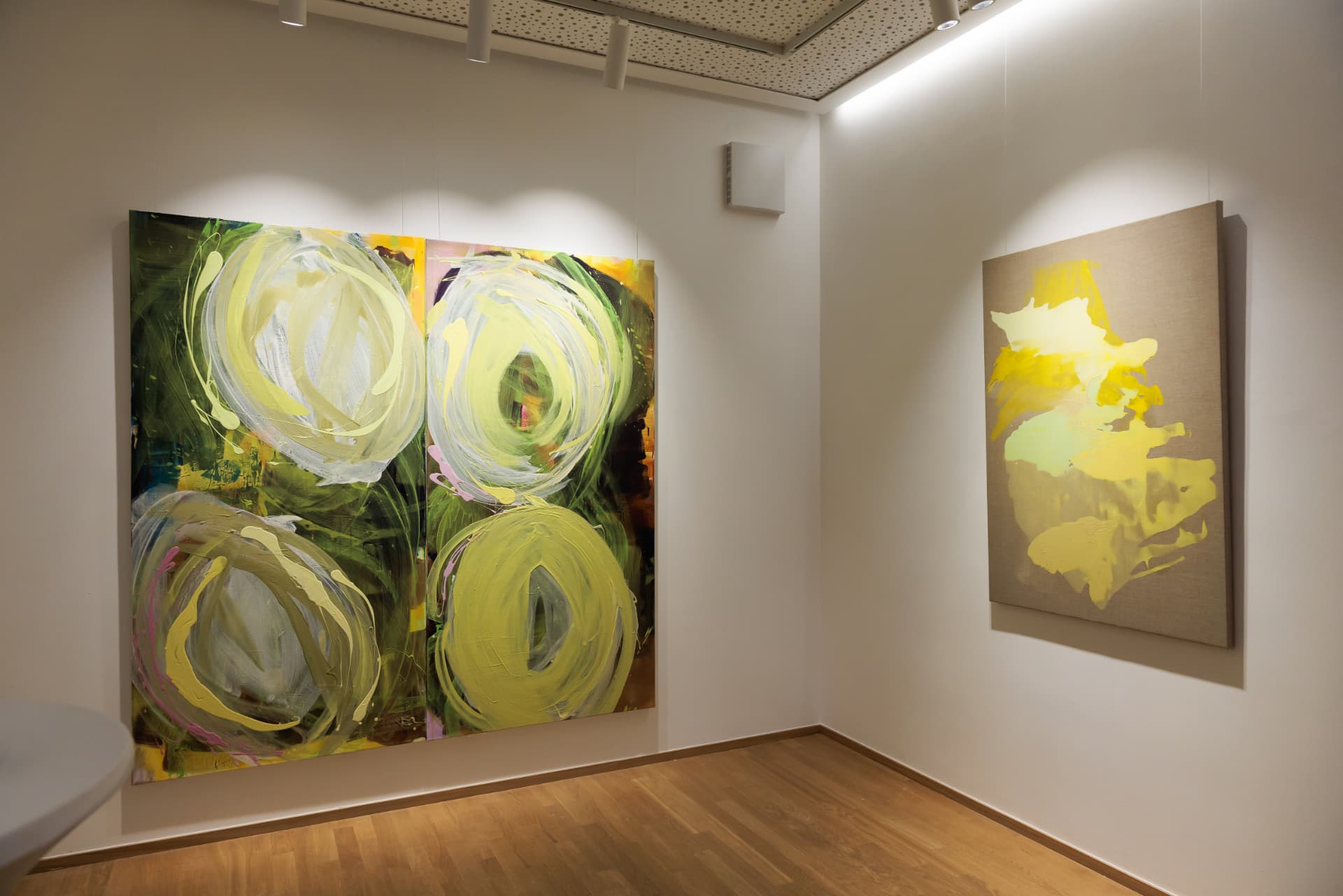 Green diptych with a yellow painting on raw linen
